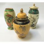 THREE PIECES OF ART DECO CARLTON WARE comprising a 'Paradise Bird & Tree' pattern jar and cover on a