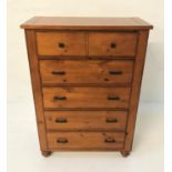 TALL PINE CHEST with a plank top above five long drawers, standing on bun feet, 137.5cm x 96.5cm