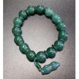 GREEN AVENTURINE BEAD BRACELET the circular beads separated by small discs