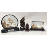 CHINESE CORK DIORAMA in a shaped case, depicting a pagoda amongst trees, 23cm high, a similar