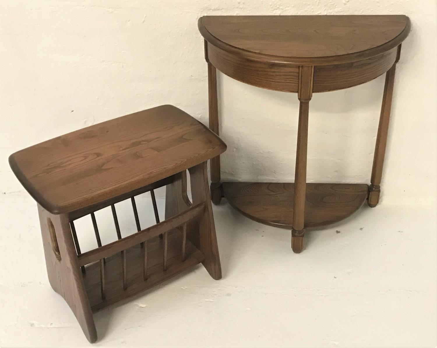 ERCOL DEMI LUNE OAK SIDE TABLE with a moulded top above a deep frieze, standing on turned tapering