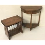 ERCOL DEMI LUNE OAK SIDE TABLE with a moulded top above a deep frieze, standing on turned tapering