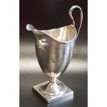 WILLIAM IV SILVER CREAM JUG raised on a square base, the body decorated with swags and inscribed R B