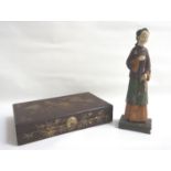 CHINESE FIGURINE of a lady in traditional dress, her head tilted to one side and looking mournful,