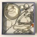 SELECTION OF SILVER JEWELLERY including bangles, a CZ line bracelet, an amethyst set ring, an