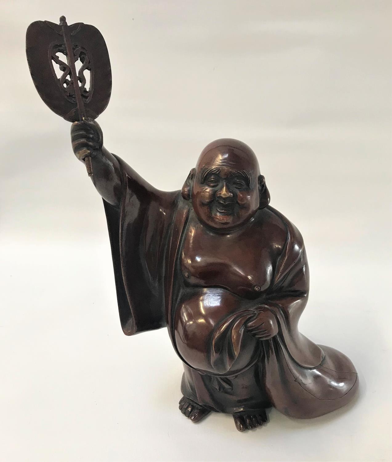 19TH CENTURY BRONZE FIGURE OF HOTEI wearing a loose open robe, with a smiling expression and one arm