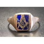 MASONIC UNMARKED GOLD RING with blue enamel compass decorated panel, approximately 5.1 grams