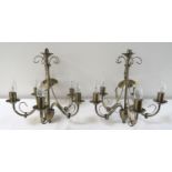 PAIR OF POLISHED STEEL CHANDELIERS each with five adjustable shaped arms, with suspension chains,