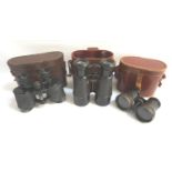 TWO PAIRS OF FIELD GLASSES both with fitted case, and a pair of opera glasses (3)