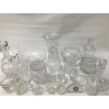 SELECTION OF CRYSTAL AND CUT GLASS ITEMS including four decanters, trumpet and other vases, table