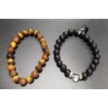 TWO BEAD BRACELETS one tiger's eye and the other onyx with heart charm (2)