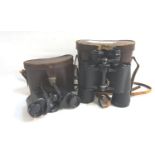 PAIR OF REGENT FIELD GLASSES with 10x50 magnification, contained in a leather case; together with