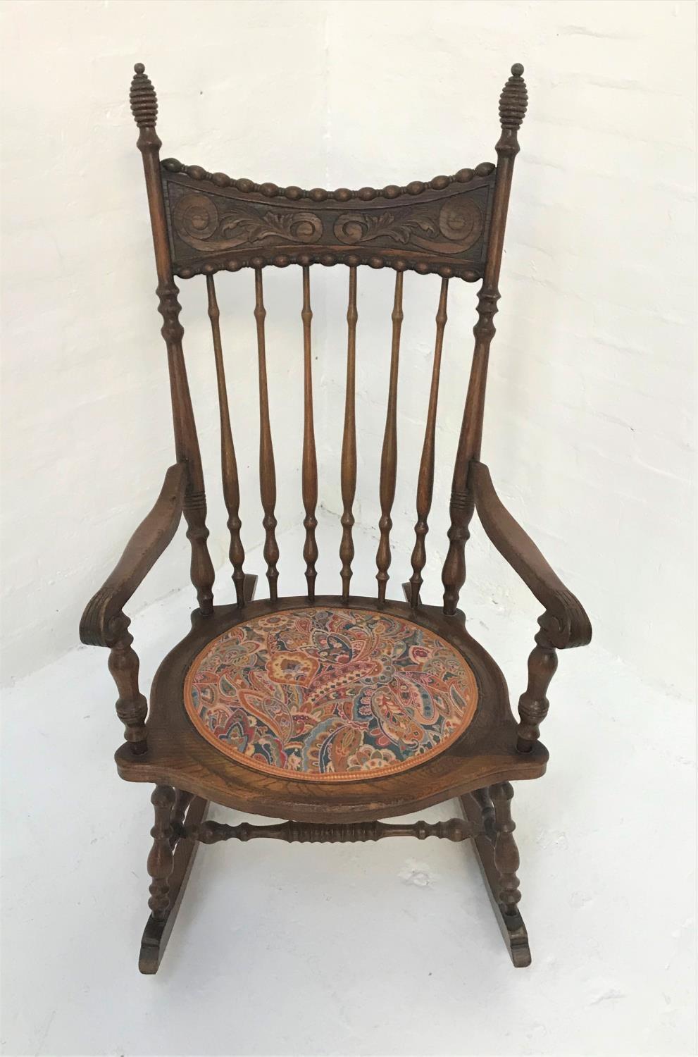 AMERICAN OAK AND ELM ROCKING CHAIR with a shaped and carved top rail above a shaped stick back - Image 2 of 2