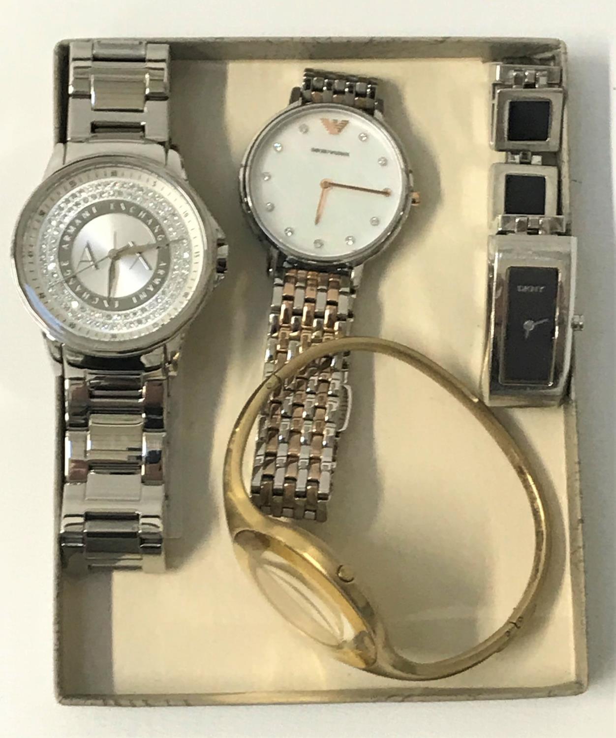 FOUR LADIES DESIGNER WRISTWATCHES comprising Emporio Armani, DKNY, Calvin Klein and Armani