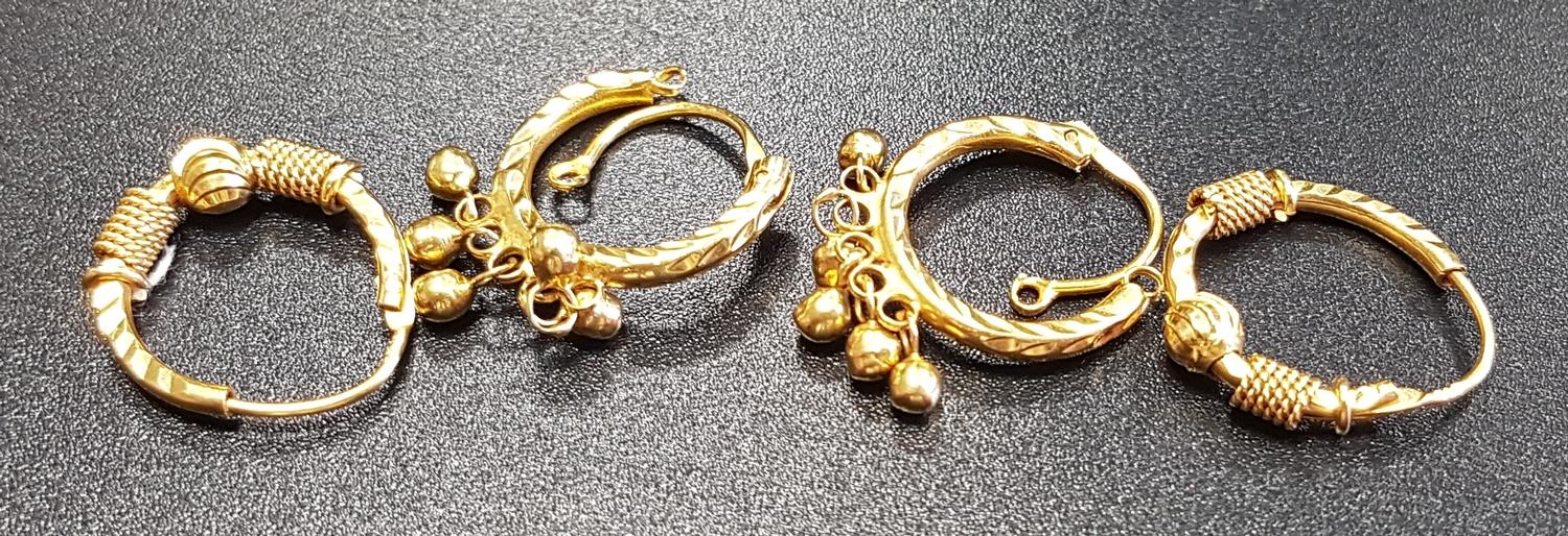 PAIR OF TWENTY-ONE CARAT GOLD EARRINGS together with a similar pair of unmarked high carat gold