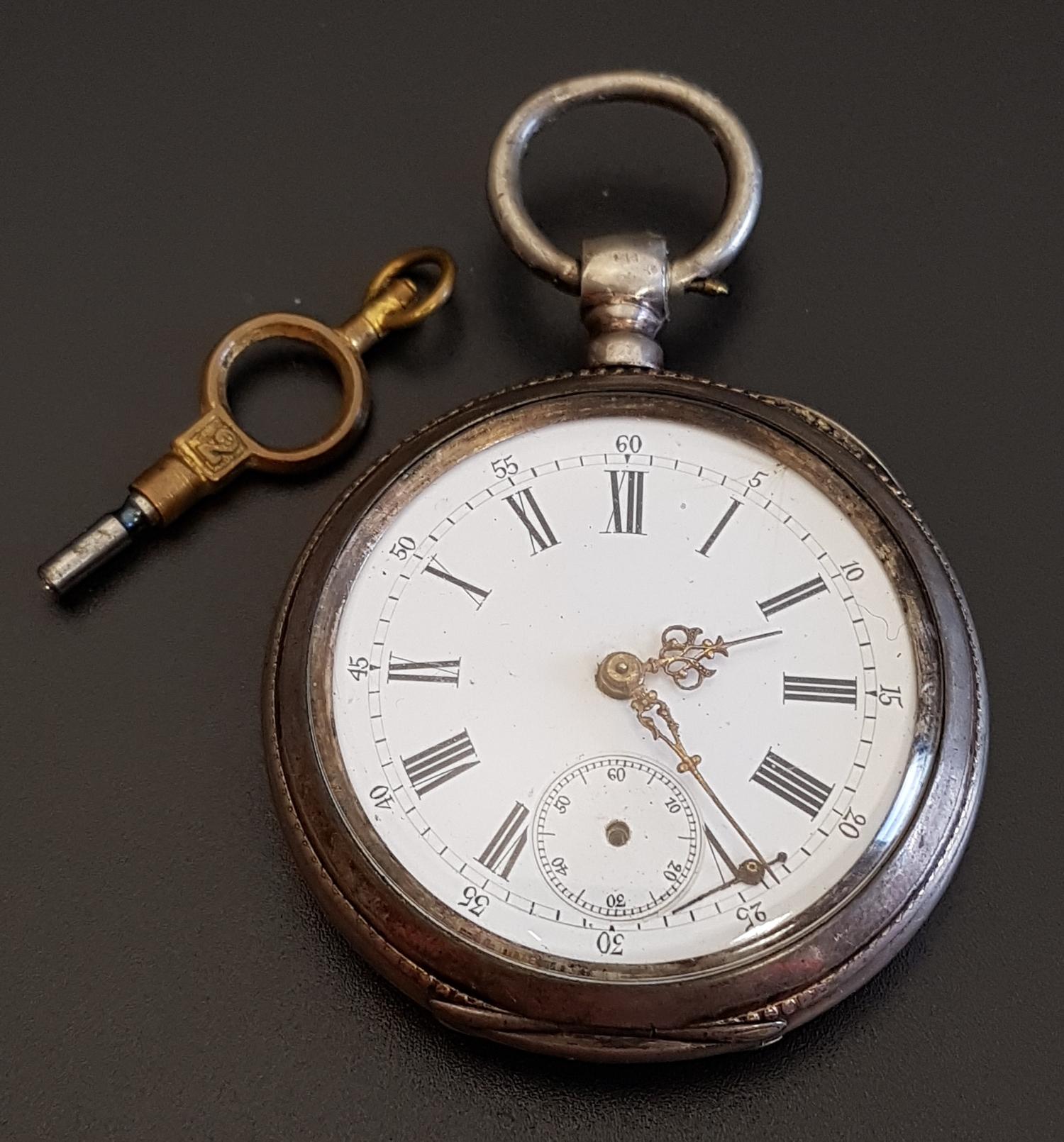 FRENCH SILVER CASED POCKET WATCH the white enamel dial with Roman numerals and subsidiary seconds