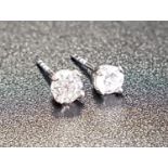 MATCHED PAIR OF DIAMOND STUD EARRINGS the diamonds totalling approximately 0.4cts, in nine carat