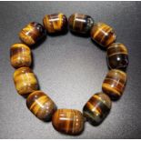 TIGER'S EYE BEAD BRACELET comprising of eleven oblong beads