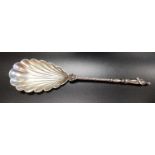 LATE VICTORIAN SILVER SPOON the bowl shaped as a shell, the stem with wavy decoration with a