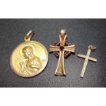 SMALL SELECTION OF RELIGIOUS GOLD JEWELLERY comprising a garnet set nine carat gold cross pendant