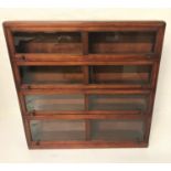 1930'S MAHOGANY SECTIONAL BOOKCASE with a moulded top above four sections, each with a glass panel