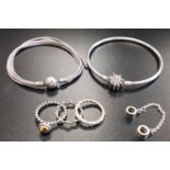 SELECTION OF PANDORA JEWELLERY comprising a bangle with CZ set flower clasp, a Floral safety