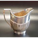 GEORGE V SILVER CREAM JUG with a half fluted body, London 1920, approximately 124 grams
