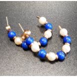 PAIR OF SEED PEARL AND LAPIS LAZULI SET HOOP STYLE EARRINGS in unmarked gold, the butterflies marked