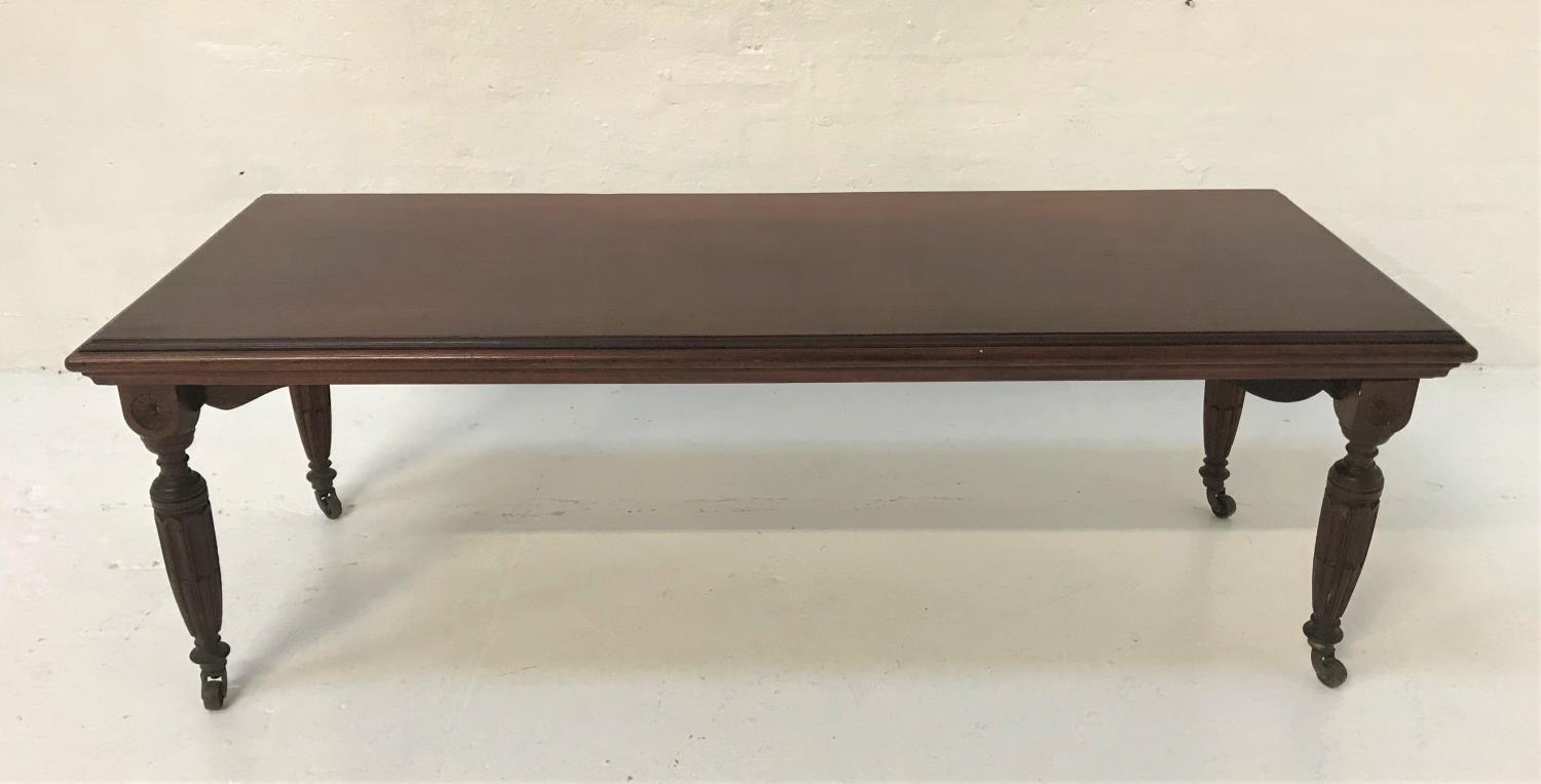 MAHOGANY OCCASIONAL TABLE with an oblong moulded top, standing on turned tapering supports with