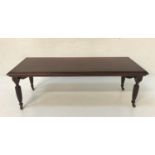 MAHOGANY OCCASIONAL TABLE with an oblong moulded top, standing on turned tapering supports with