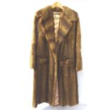 LADIES VINTAGE MUSQUASH FULL LENGTH COAT with pockets and button fastening, bearing a trade label