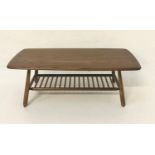 ERCOL OAK OCCASIONAL TABLE with an oblong top, standing on turned shaped supports united by a