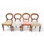 HARLEQUIN SET OF FOUR VICTORIAN BALLOON BACK DINING CHAIRS with stuffover seats, standing on