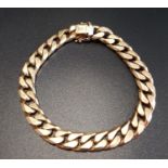 NINE CARAT GOLD CURB LINK BRACELET with safety clasps, approximately 22cm long and 51.3 grams