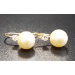 DIAMOND AND SIMULATED PEARL EARRINGS in fourteen carat gold
