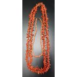 CORAL BRANCH NECKLACE 129cm long; together with a graduated coral bead necklace, 36cm long