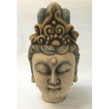 CARVED POLYCHROMED HEAD OF GUANYIN with a serene expression, eyes closed and mouth relaxed,