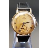 GENTLEMAN'S NINE CARAT GOLD CASED SMITHS DE LUXE WRISTWATCH 1950s, the gilt dial with Roman numerals