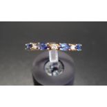 SAPPHIRE AND DIAMOND HALF ETERNITY RING with alternating marquise cut sapphires and round