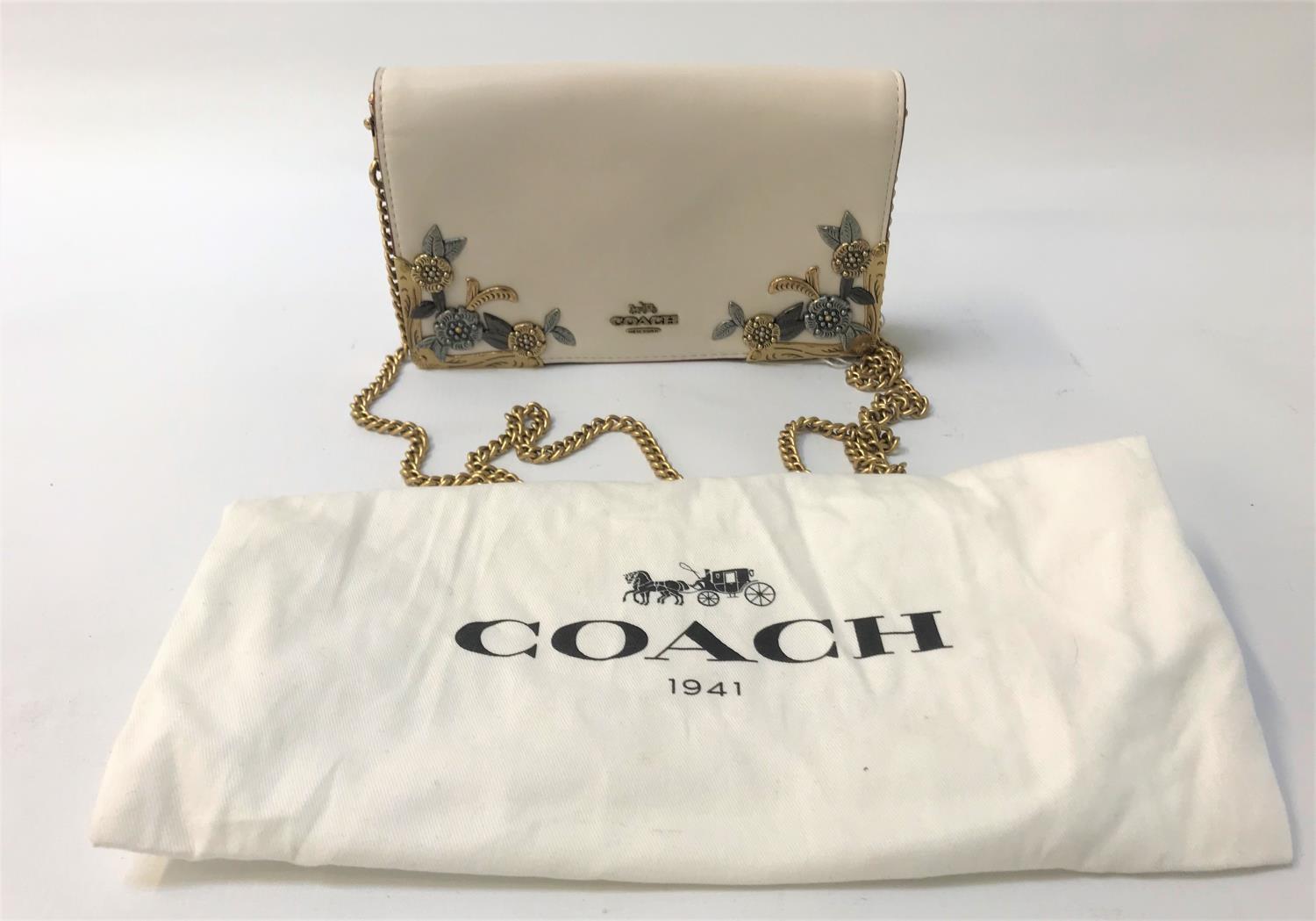 COACH EVENING BAG the cream bag with floral metal decoration, metal chain shoulder strap and