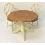 CIRCULAR TEAK KITCHEN TABLE with shaped drop flaps, standing on a turned painted column with four