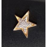 PAVE SET DIAMOND STAR SHAPED PENDANT in unmarked gold