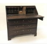 18TH CENTURY OAK BUREAU with a fall flap opening to reveal a fitted interior above two short and