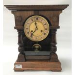 GERMAN H.A.C. OAK MANTLE CLOCK with a circular dial with Roman numerals and an eight day movement,