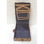 VINTAGE TRAVELLING WARDROBE with leather banding and brass locks, the fitted interior with hanging