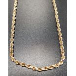 NINE CARAT GOLD TWIST NECK CHAIN marked 375 and 10K, 46cm long and approximately 12.2 grams