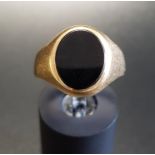 BLACK AGATE SET SIGNET RING in nine carat gold, ring size O-P and approximately 3.8 grams