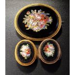 MICRO MOSAIC JEWELLERY comprising an oval brooch and a pair of cufflinks, all decorated with flowers