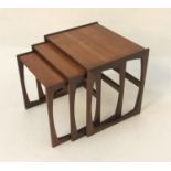 G PLAN MAHOGANY NEST OF TABLES with rectangular tops, standing on shaped supports, 53.5cm wide