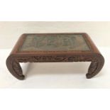 CARVED CHINESE TEAK OCCASIONAL TABLE with an inset glass top revealing a harbour scene above a